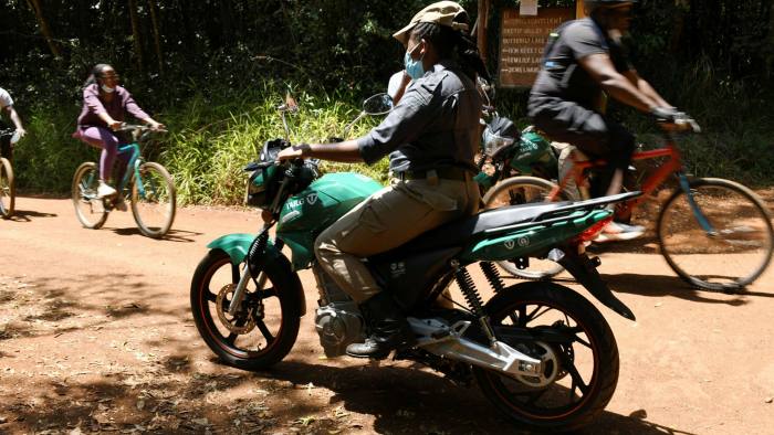 A Karura forest scout on patrol using an electric motorcycle