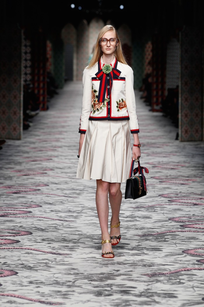 Embroidered silk/cotton-faille jacket, £2,270, and matching skirt, £915, studded leather sandals, £915, leather bag, £1,510