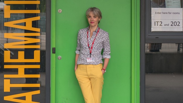 Lucy Kellaway in front of a maths classroom
