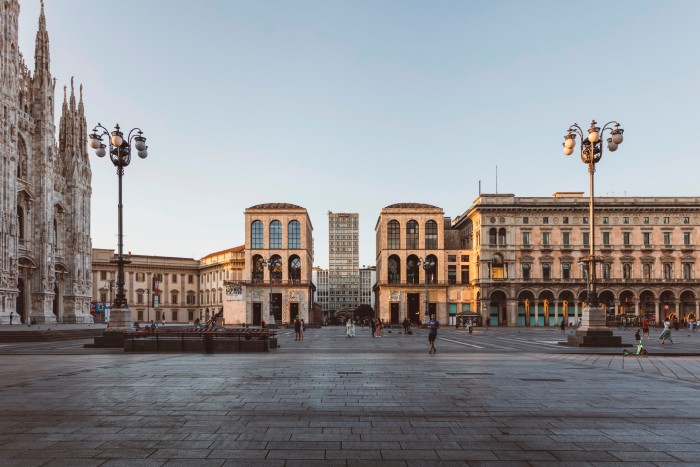 The fascist-era Palazzo dell’Arengario in Milan: two identical Modernist arched buildings to the left of which can be seen the Duomo