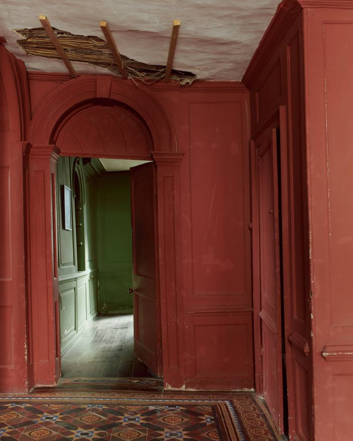 The Green Drawing Room seen from the Patterned Hall – the damaged ceiling exposed local Fenland reeds that are more than 300 years old