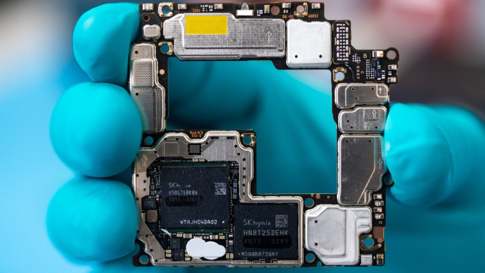Components of a Huawei Mate X5 smartphone, including a Kirin 9000s chip fabricated in China by Semiconductor Manufacturing International Corporation
