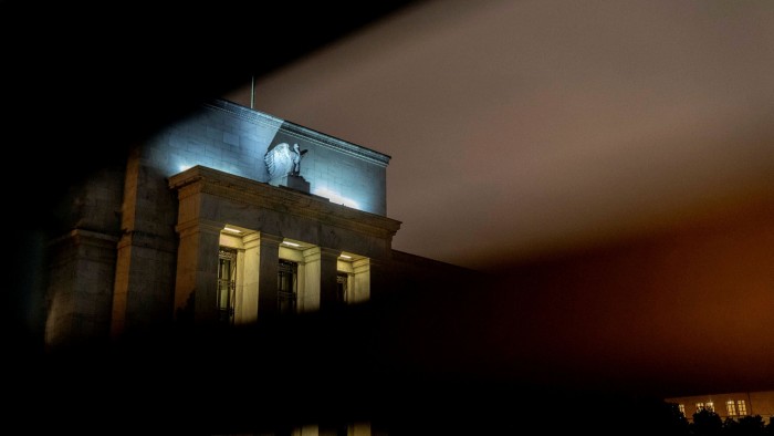 Exterior of Federal Reserve lit up in the dark
