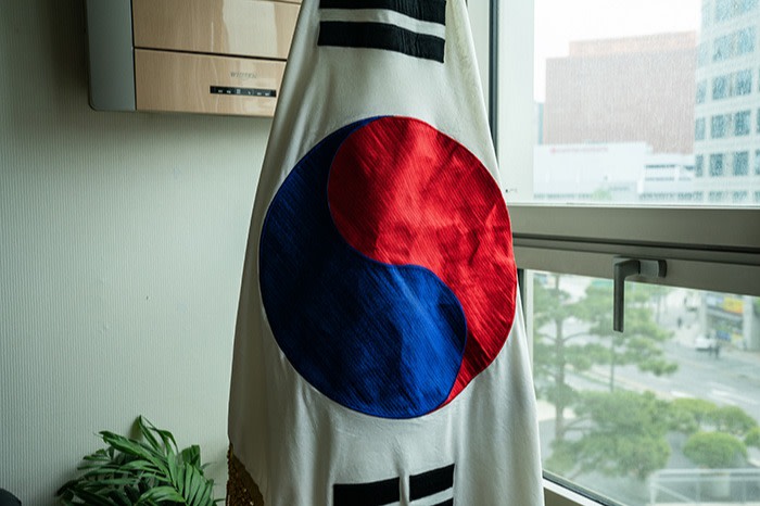 A South Korean flag hangs in Lee Soon-geum’s office