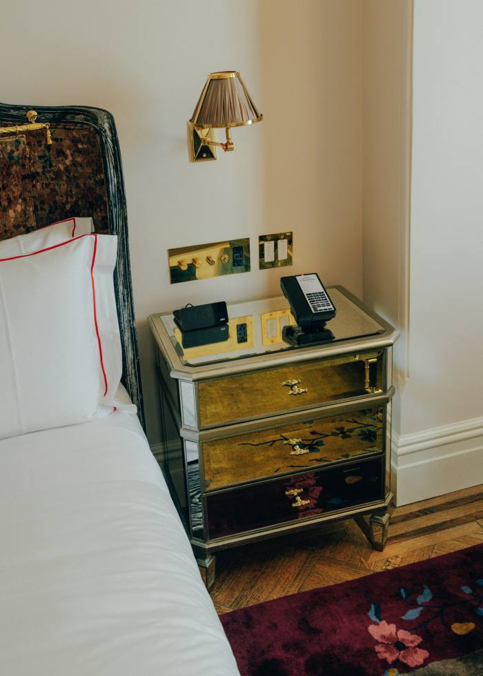 A bedside table in one of the rooms