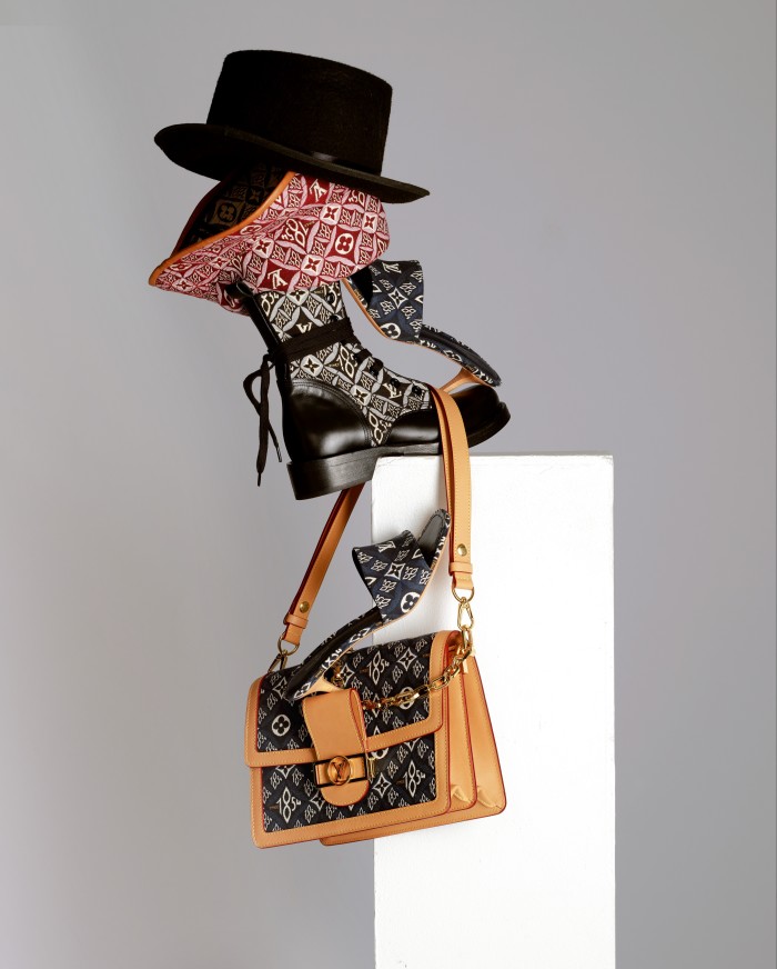 Nicolas Ghesquière reinterprets Louis Vuitton’s signature print 1854 – the year the house was founded. From top: Louis Vuitton jacquard-weave and leather Since 1854 hat, £545, Metropolis Flat Rangers boots, £1,260, Revival mules, £620, and Dauphine MM bag, £2,740, louisvuitton.com