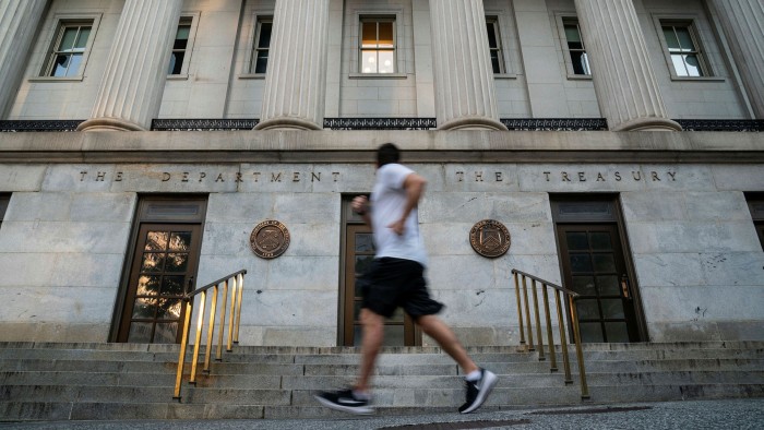 A man jogs past the US Treasury building