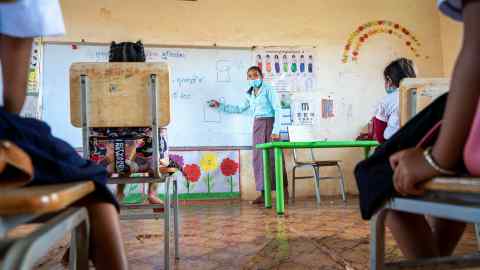 A teacher at the village primary school of Trom, in Cambodia, during the pandemic