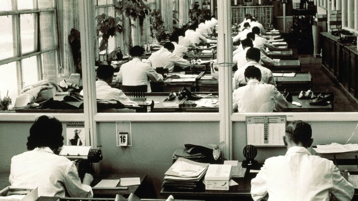 Employees at work in an office in the1960s. Companies must engage with staff if they want to diversify their leadership and talent pipeline