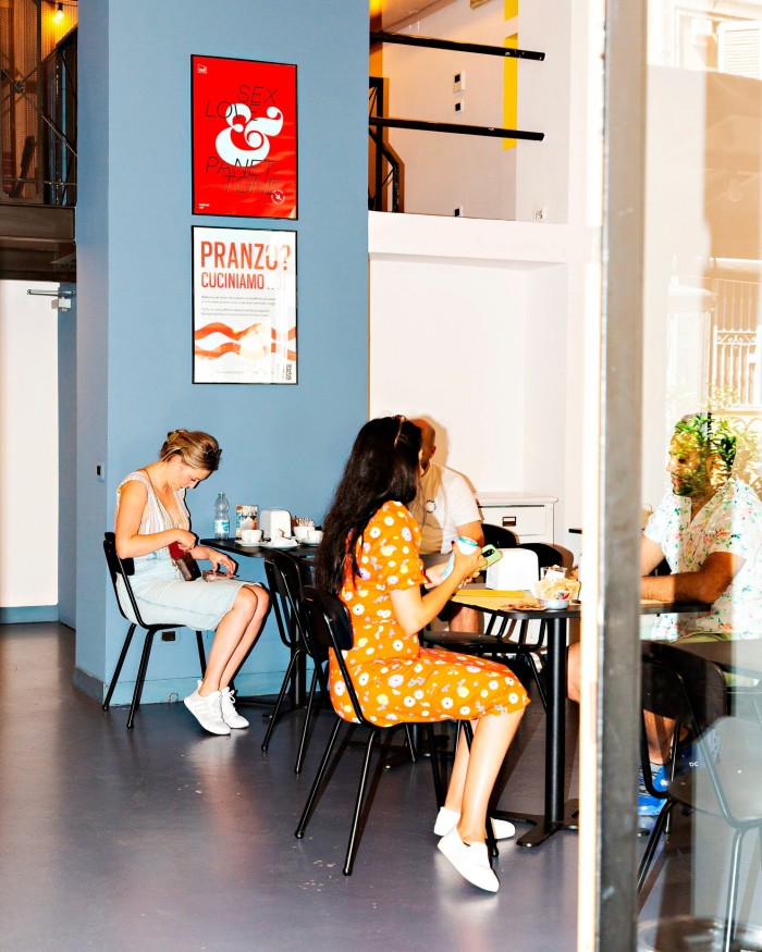 Customers sitting at tables in Pavé