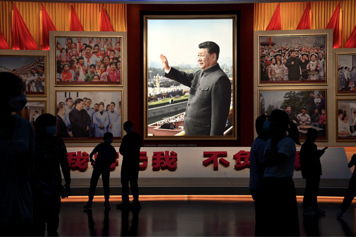 People view images of China’s president Xi Jinping in Beijing. Under Xi, censorship has been tightened, power has become more concentrated at the top and access for foreigners has been sharply restricted 
