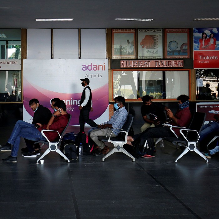Passengers wait to board their flights after Adani Group took over operations of Sardar Vallabhbhai Patel International Airport in Ahmedabad last week