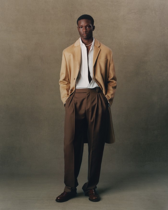 Prada cashmere coat, £4,550, and cotton poplin shirt, £545. Ermenegildo Zegna wool trousers, £850. Church’s leather loafers, £460. Alighieri gold-plated-bronze and freshwater-pearl necklace, £250