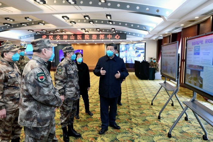 Wuhan: Officials brief Xi Jinping, right, about the Covid-19 outbreak during the president's visit in March. 'Coronavirus appears to have strengthened Xi’s grasp on power,' says Jessica Chen Weiss of Cornell University