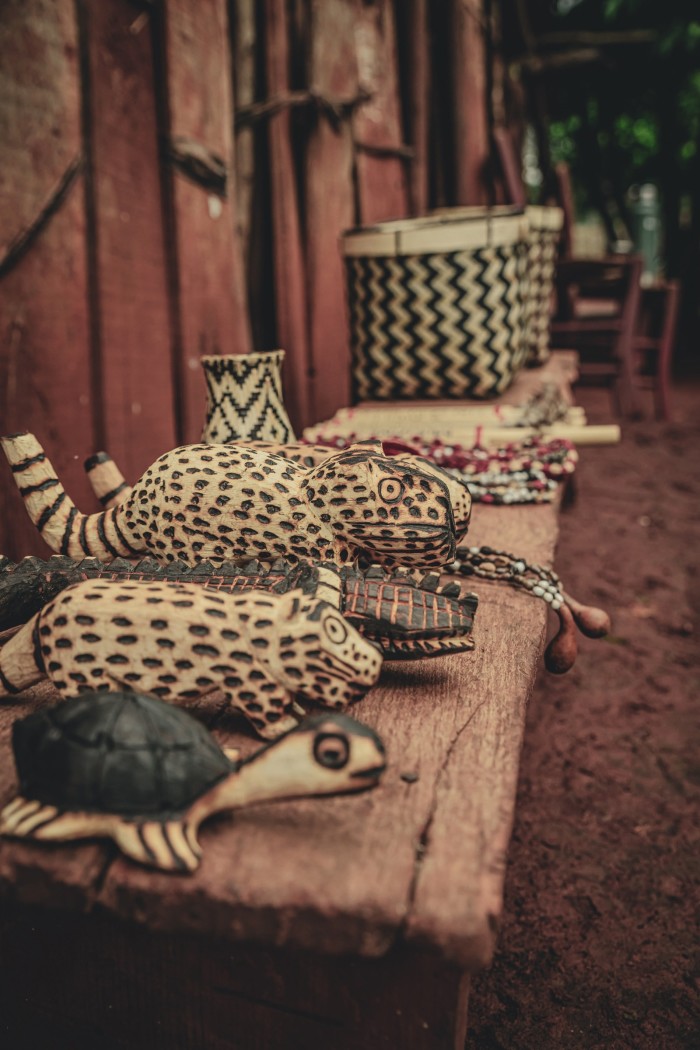 Wood-carved animals and traditional woven baskets made in Misiones Province