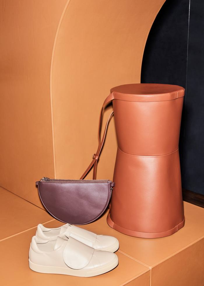 Isaac Reina for At.Kollektive leather Round Velcro shoes, £342, leather Mobile M+ pouch, £1,035, and leather Tubular large bag, £1,729