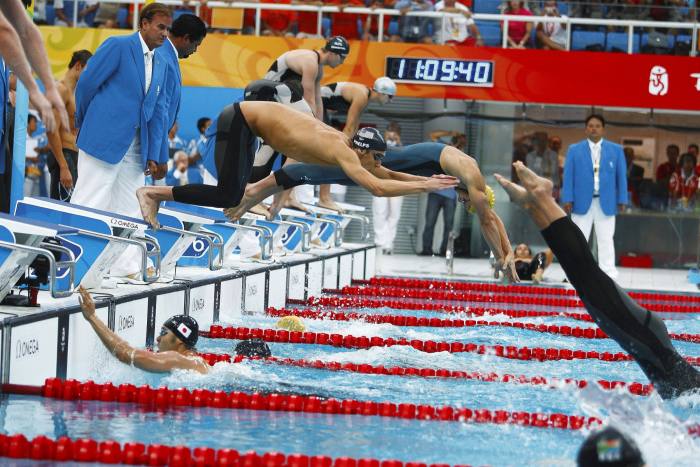 Swimming: 2008 Summer Olympics: USA Michael Phelps in action during start of third leg of Men’s 4x100M Medley Relay Final at National Aquatics Center