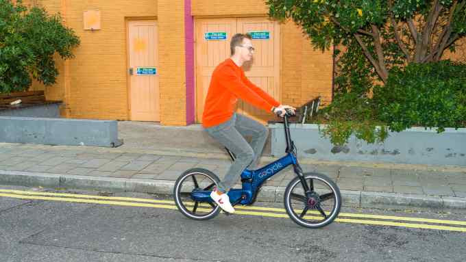 The author on a Gocycle GX, £2,899. He wears Café du Cycliste cotton Clementine sweatshirt, £83, and APC denim Petit Standard jeans, £175, from matchesfashion.com