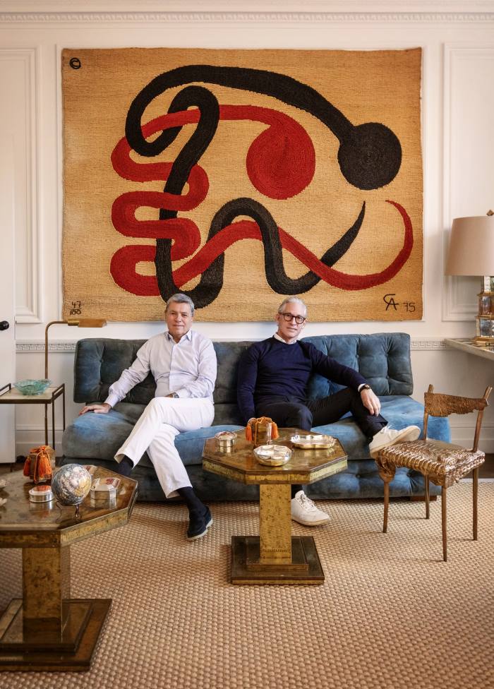 The pair in the second first-floor drawing room with its bronze-gilt Claude Lalanne Chaise Crocoseat. Behind them is a jute tapestry by Alexander Calder