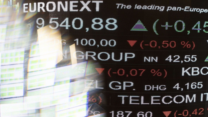 Trading data on a digital board at the Euronext stock exchange in Paris, France