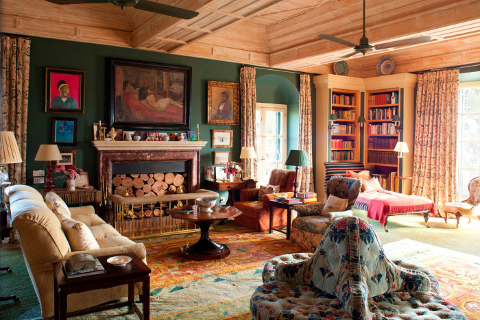 room stuffed with antiques, rugs, paintings