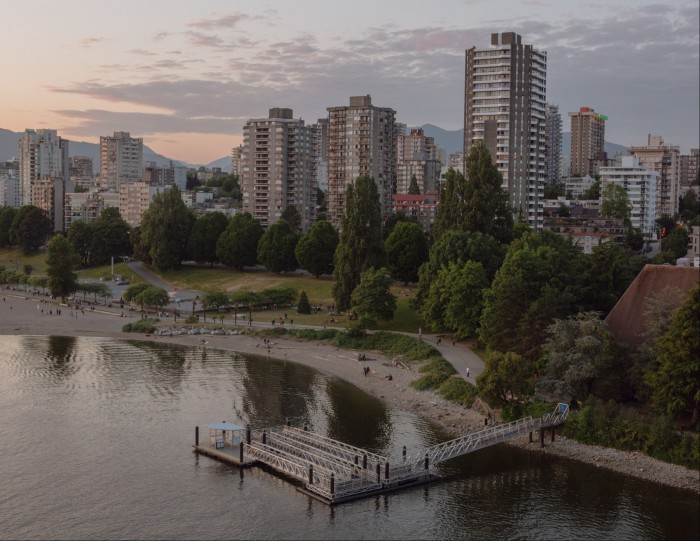 Sunset Beach, as seen from Burrard Street Bridge, with the high-rises of downtown Vancouver behind it 