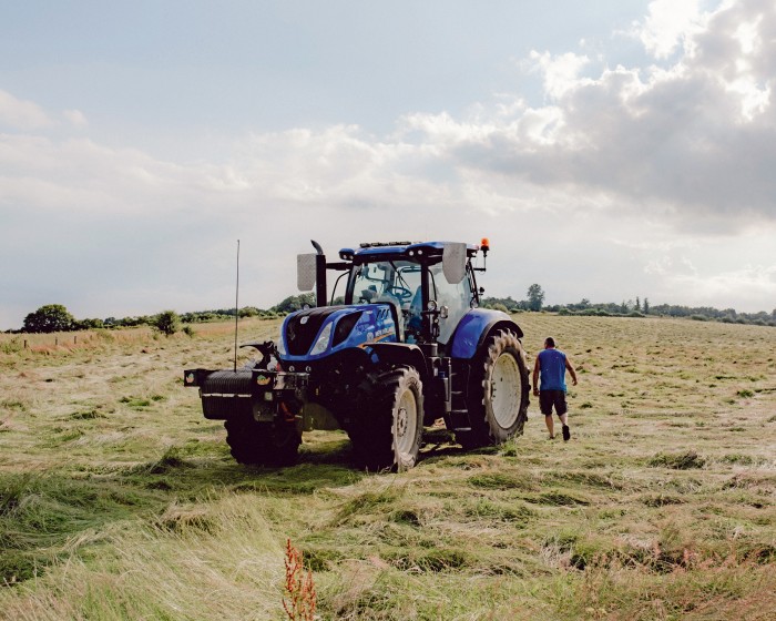 A tractor on the unploughed land at Colleymore Farm, Coleshill, which is rented by Wildfarmed from the National Trust 
