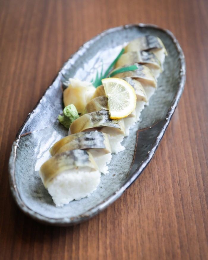 An oval dish of Mugen’s mackerel sushi