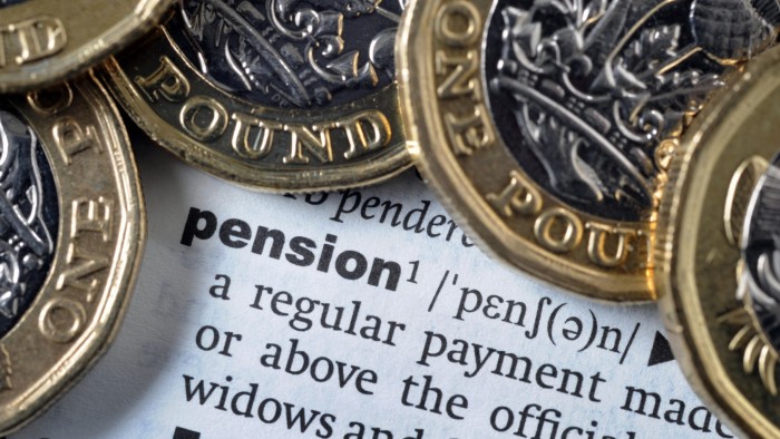 Pound coins sit on a dictionary entry for the word ‘pension’