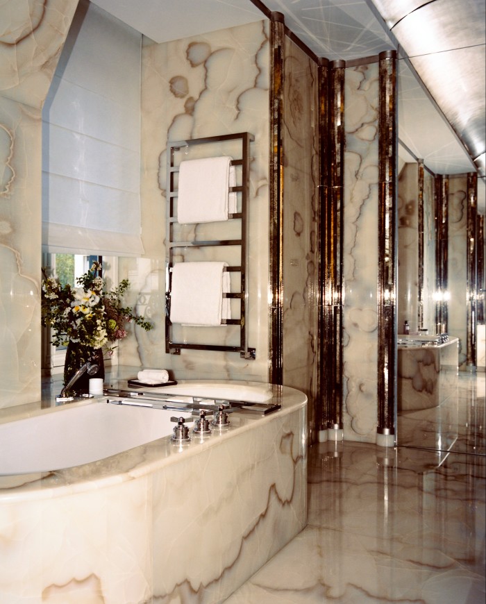 The bathroom is fitted entirely in onyx