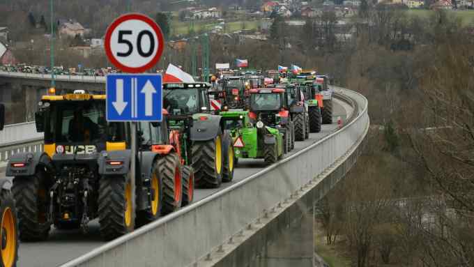 Farmers with their tractors block the border bridge with the Czech Republic, during a farmers’ protest in Cieszyn, southern Poland,