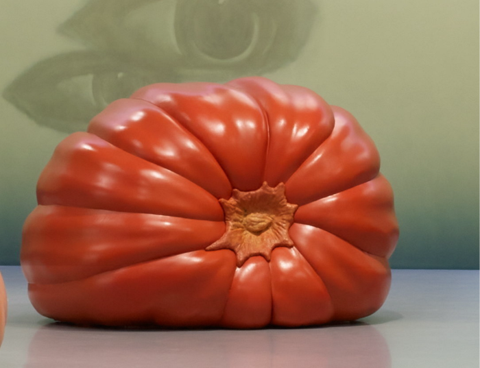 A large dark orange pumpkin on its side, slightly depressed