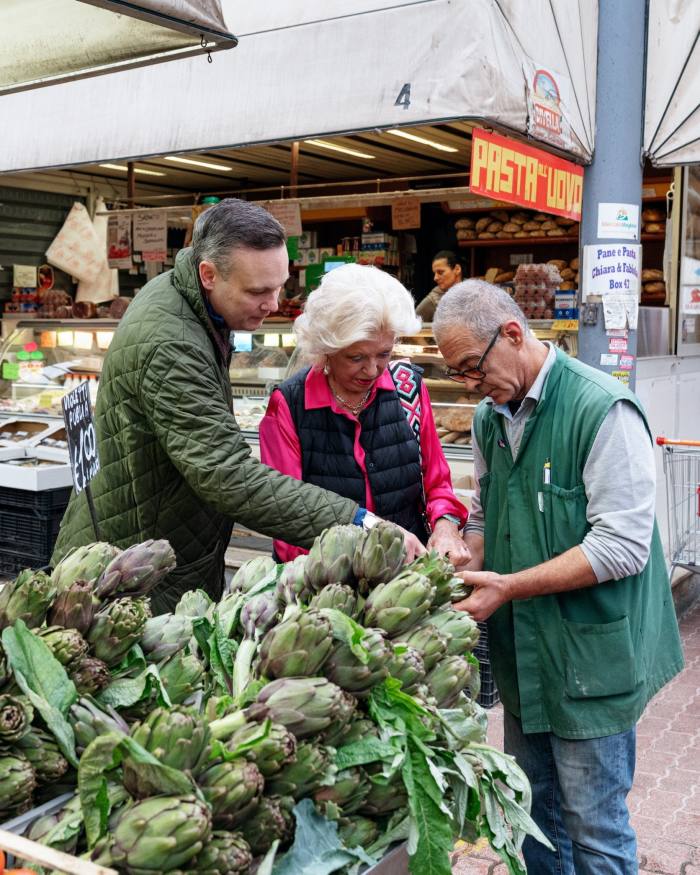 Orson Francescone and his mother Pamela picking artichokes with Sergio the owner of the local vegetable stall