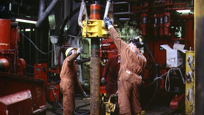 Workers on a Shell oil drilling platform
