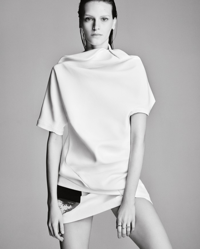 Issey Miyake cotton-mix Torso tunic, £835, and matching Torso skirt, £660. Saskia Diez silver wire double ear cuff, €74. Maria Black rhodium-plated recycled-silver Ember ring, £84, Ena ring, £111, and Bess ring, £105