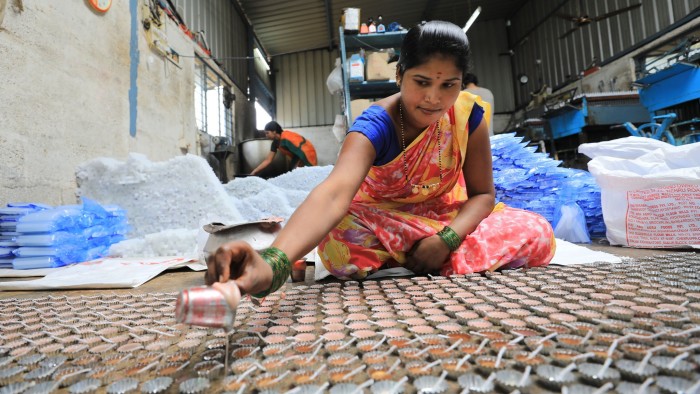 Indian woman preparing food in a factory