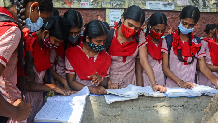Students reading books before taking Madhyamik examination