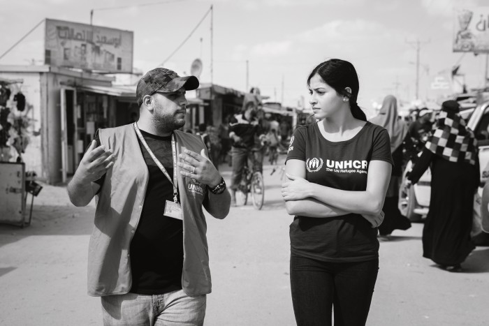 Mardini walks through the Zaatari refugee camp in Jordan in 2019