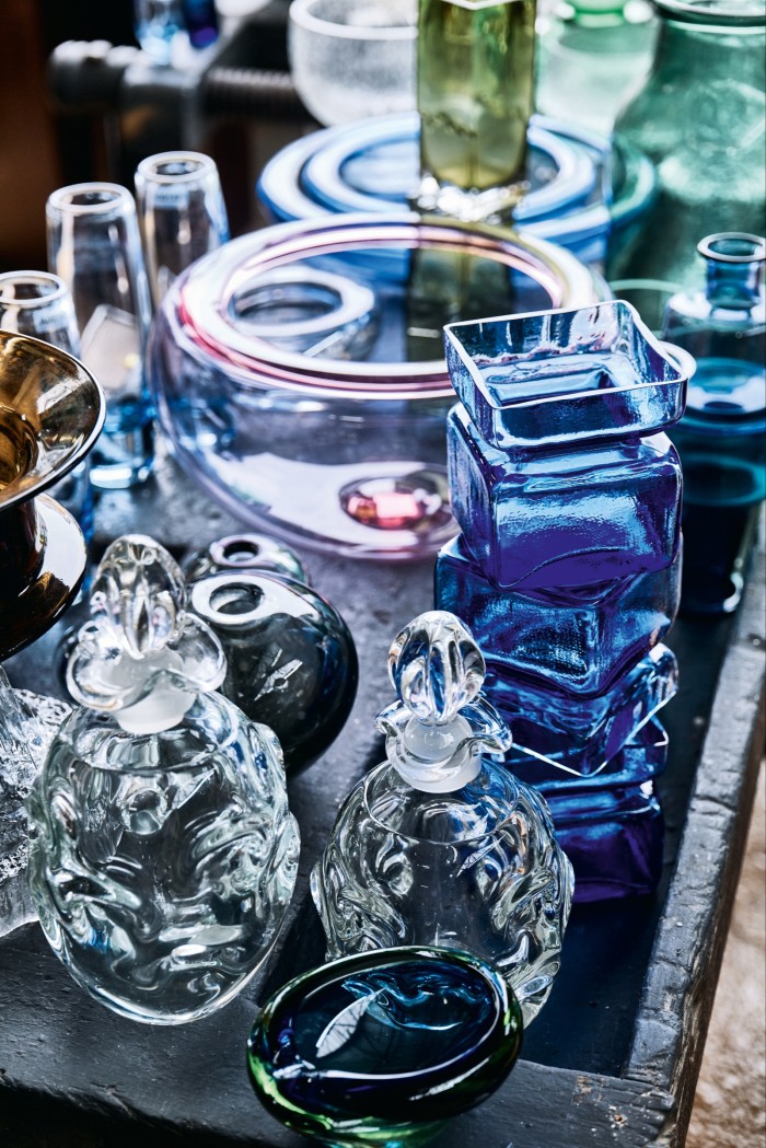 Green vase (top) by Tapio Wirrkala, tall blue vase (right) by Helena Tynell and clear vases and bowl (middle) by Per Lütken
