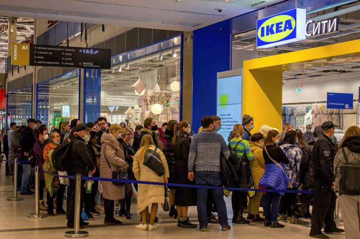 People line up at the entrance to Ikea Rostokino in Moscow after the Swedish company announced plans to temporarily close its shops in Russia