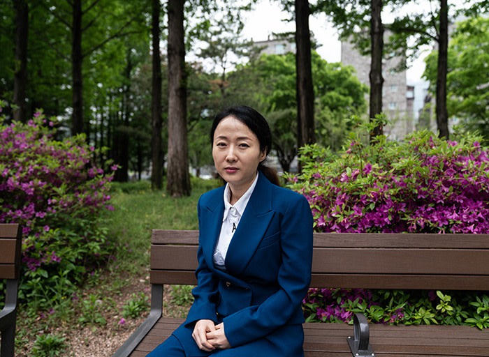Lee Han-byeol in a park outside of her home