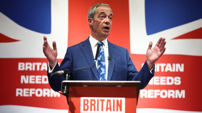 Newly appointed Reform party leader Nigel Farage speaks during a campaign meeting on Monday