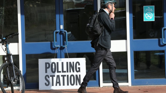 Man walks in front of polling station