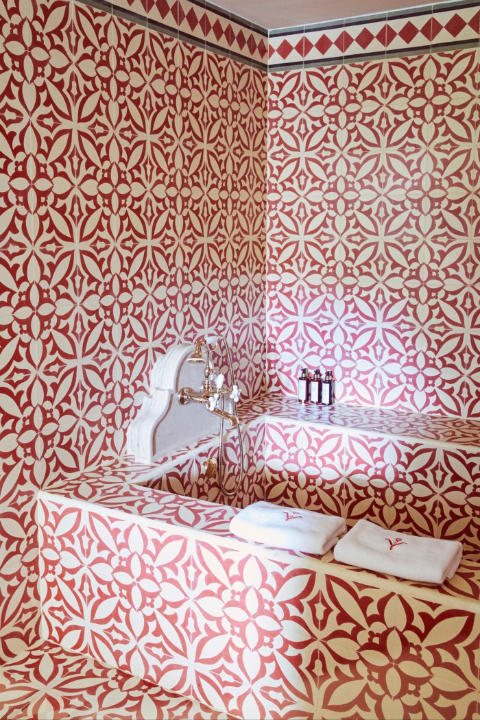 The azulejo-tiled bathroom in one of the garden-level bedrooms