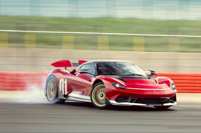 a red sportscar drifting on a racetrack
