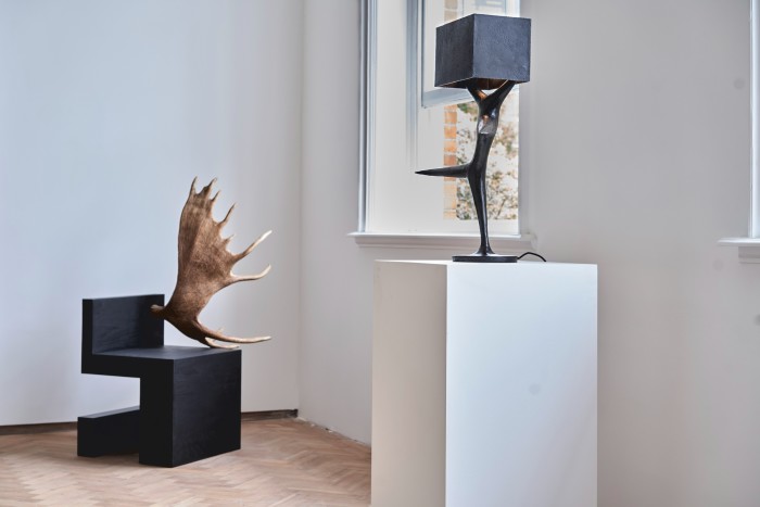 Stag Chair Black Plywood Right, 2007, by Rick Owens (left) and Ballerina Lamp, 2019, by Atelier Van Lieshout