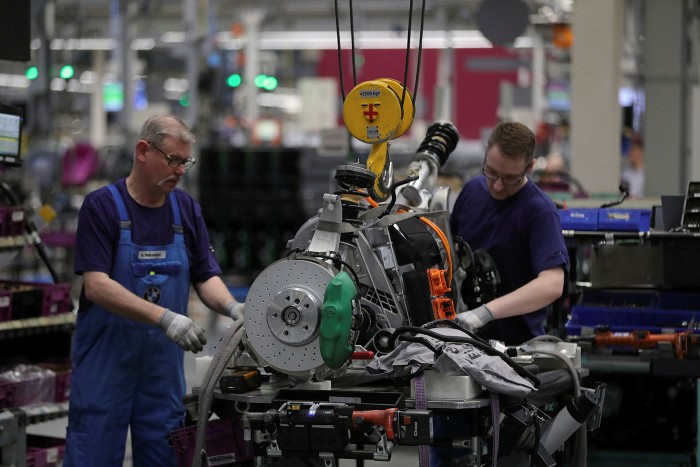 An assembly line for BMW’s hybrid i8 car