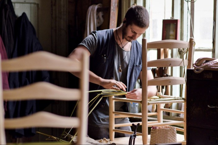 Artisan Sam Cooper making a rush seat at the Marchmont Workshop in the Scottish Borders