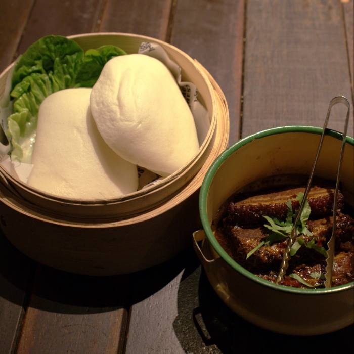 The wide-ranging menu includes steamed buns with braised pork in soy sauce, as well as Aussie-style breakfasts and salads
