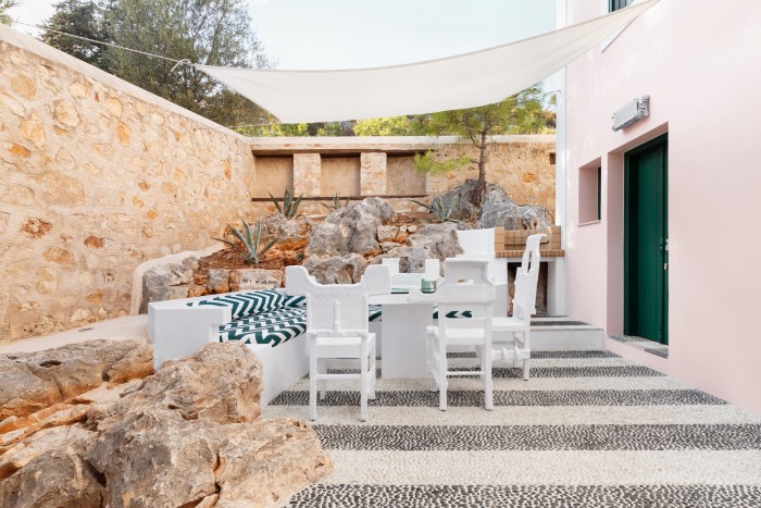The courtyard features a lounge area with a barbecue as well as the Trashformers Taverna chairs
